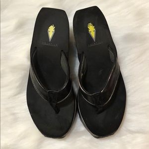 Volatile black flip flops